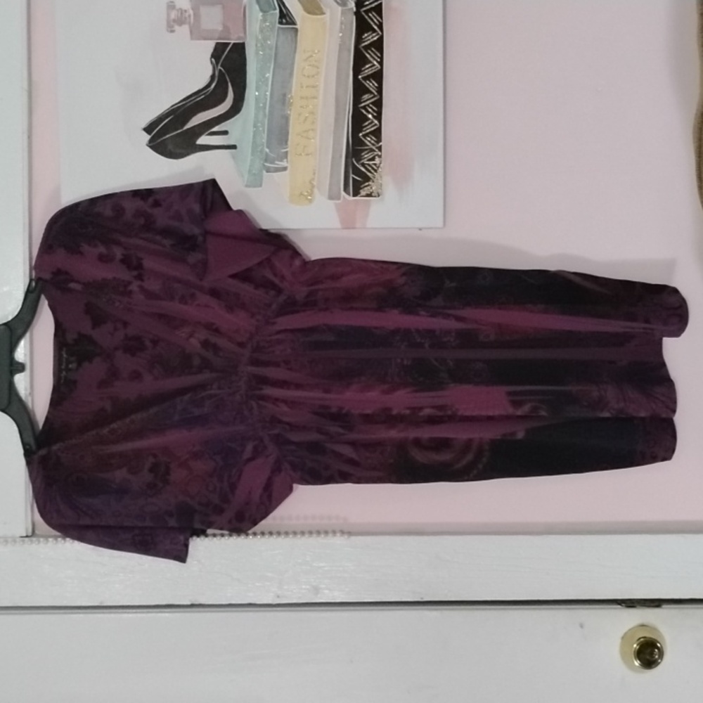 Med purple dress with designs